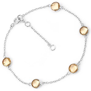 May include: A silver chain bracelet with five round, faceted, topaz gemstones. The bracelet has a lobster claw clasp.