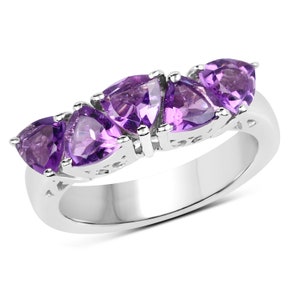 May include: A silver ring with five triangular amethyst gemstones set in a decorative band.