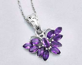 May include: A silver necklace with a pendant shaped like a butterfly with purple amethyst stones.