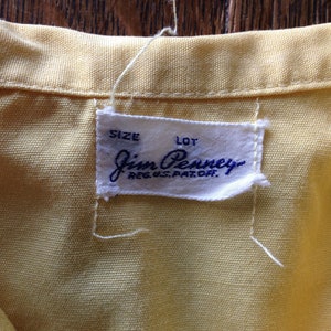 May include: A white tag with blue text that reads "J.C. Penney Reg. U.S. Pat. Off." with the words "Size" and "Lot" above the company name.