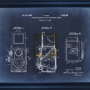 May include: A blueprint style illustration of a camera focusing mechanism patent. The patent is titled "Focusing Mechanism for Twin Lens Reflex Cameras" and was filed on August 30, 1946. The patent number is 2,495,355.