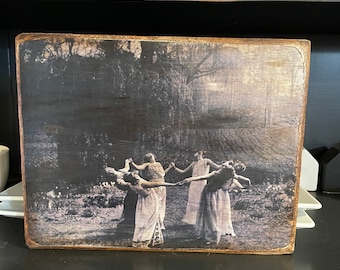 Witches dancing under the moon