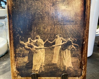 Witches dancing under the moon /vertical