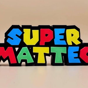 Nome a tema Super Mario personalizzato per festa di Compleanno decorazione torta Nintendo Retrogaming Videogiochi.