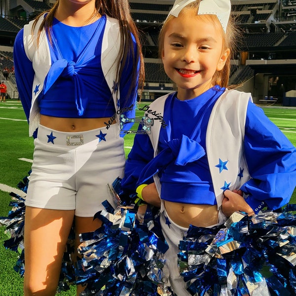 Kids Dallas cowboys cheerleader outfit includes vest, blue top, white shorts, pom poms. Bows sold separately