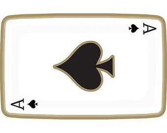 May include: A rectangular playing card featuring the Ace of Spades. The card has a white background with a large black spade symbol in the center, and the letter "A" with a small spade in each corner. The card is framed with a gold border.