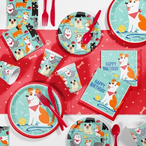 May include: A festive dog-themed party set with plates, cups, napkins, and cutlery. The plates and napkins feature a cartoon dog with a red bandana and the words "Happy Birthday." The set includes red forks, knives, and spoons.