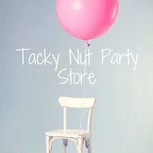 May include: A pink balloon floats above a white chair against a light blue background. The text "Tacky Nut Party Store" is written in white cursive script on the wall. The chair has a distressed, vintage look.