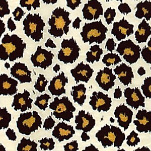 May include: A repeating pattern of dark brown leopard spots with golden yellow centers on a cream-colored background. The spots vary in size and shape, creating a textured, animal print design. This pattern is suitable for fabric, wallpaper, or other decorative applications.