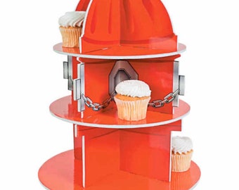 May include: A red, three-tiered cupcake stand shaped like a fire hydrant. The stand has a silver top and silver accents. White frosted cupcakes are displayed on each tier. The stand is made of a glossy material.