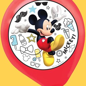 May include: A red balloon featuring Mickey Mouse with a white circular design. The design includes Mickey Mouse, various doodles, and the word "MICKEY!". The balloon is against a yellow background.
