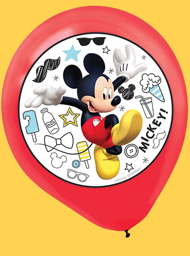 May include: A red balloon featuring Mickey Mouse with a white circular design. The design includes Mickey Mouse, various doodles, and the word "MICKEY!". The balloon is against a yellow background.