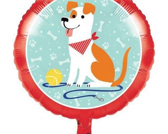 May include: A round, red foil balloon featuring a cartoon dog with white and orange fur, a red bandana, and a yellow tennis ball. The dog is on a light blue background with paw prints and bones. A blue leash is also present.