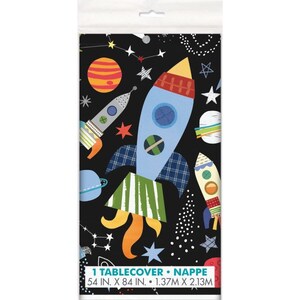 May include: A black rectangular tablecloth featuring a space-themed design. The design includes rockets, planets, stars, and constellations in various colors. The tablecloth measures 54 inches by 84 inches.