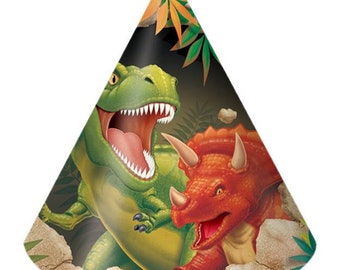 May include: A cone-shaped party hat featuring a green Tyrannosaurus Rex and a red Triceratops. The dinosaurs are set against a dark background with foliage and rocks. The hat is designed for a dinosaur-themed birthday party.