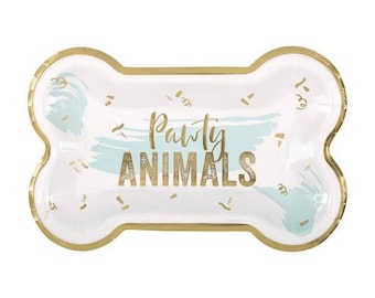 May include: Bone-shaped party platter with gold trim. The white surface features a light blue brushstroke design and gold confetti. The words "Party Animals" are written in gold script.