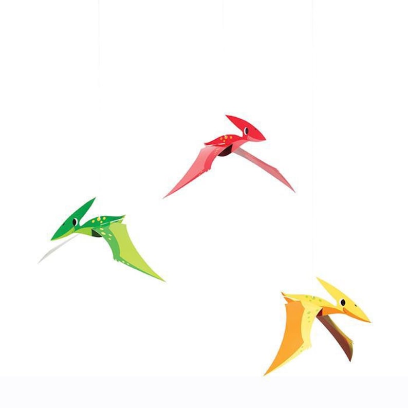May include: Three cartoon pterodactyls flying against a white backdrop. One is red, another is green, and the third is yellow and orange. The pterodactyls have pointed beaks and wings.