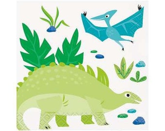 May include: A square paper napkin featuring a cartoon dinosaur and a pterodactyl in a prehistoric scene. The dinosaur is light green with a textured back, and the pterodactyl is blue with outstretched wings. Green foliage and blue accents complete the design.