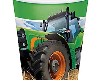 May include: A paper cup with a green and white design featuring a green tractor with an orange wheel. The tractor is set against a background of a blue sky and wheat field. The cup has a white rim.