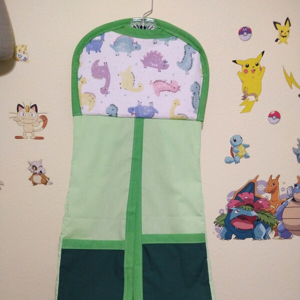 Hanging Diaper holder, diaper organizer, Towel or blanket holder. multicolored Dinosaurs. Green.