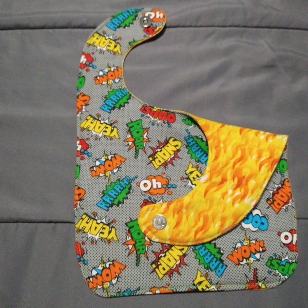 Large Reversible cotton Baby/Toddler bib with inner absorbent cotton layer. Magnetic Closure. Flames Comics.
