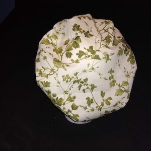 Bouffant style scrub cap. Green trees/birds