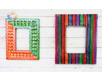 May include: Two rectangular picture frames. The left frame features a red and green scalloped pattern with yellow dots. The right frame displays vertical stripes in orange, red, green, purple, and blue. Both frames have a hollow center.