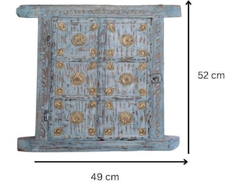May include: A light blue wooden window frame with a distressed finish, featuring gold-colored metal floral accents and circular medallions. The frame measures 52 cm in height and 49 cm in width, with visible metal hinges and a latch on the side.