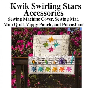 May include: A set of sewing accessories featuring a white sewing machine cover with colorful star designs, a white sewing mat with colorful star designs, a white mini quilt with colorful star designs, a white zippered pouch with colorful star designs, and a white pincushion with colorful star designs. The text "Kwik Swirling Stars Accessories" is at the top of the image. The text "two kwik quilters TKQ70" is at the bottom of the image.