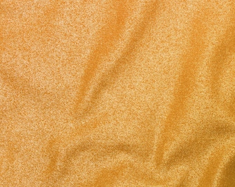May include: A close-up of a gold fabric with a subtle shimmer. The fabric has a textured, slightly wrinkled surface.