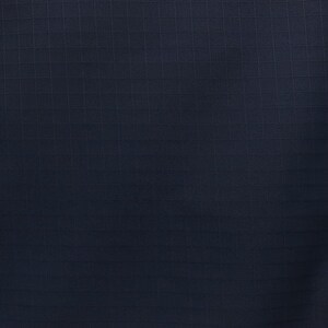 May include: A dark navy blue fabric featuring a distinct grid pattern, commonly known as ripstop. The material displays a uniform, woven texture with intersecting horizontal and vertical lines that create a consistent square check design throughout.