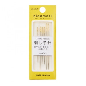 May include: A yellow package of sashiko needles labeled "hidamari SASHIKO&" with the text "刺し子針" (Sashiko needles) and "針サイズ4種類セット 糸通し付き" (4 sizes of needles with threader) in Japanese. The package is labeled "No. 4345" and "MADE IN JAPAN".