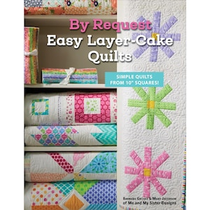 May include: A book cover titled "By Request Easy Layer-Cake Quilts" with a white background and colorful quilts. The book features the text "SIMPLE QUILTS FROM 25.4 cm SQUARES!" and is by Barbara Groves & Mary Jacobson.