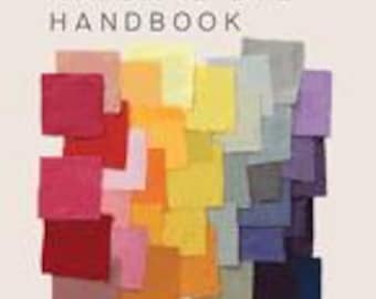 May include: A book titled "The Natural Dye Handbook" with a beige cover. The cover features a collage of colorful fabric swatches in shades of red, orange, yellow, green, blue, and purple. The book's subtitle reads: "A comprehensive guide to dyeing with plants for beginners and beyond."