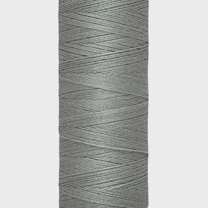 May include: A spool of gray Gütermann thread. The label at the top reads "Gütermann". The bottom label indicates 100 meters or 110 yards of thread. The thread is tightly wound around the spool.