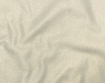 May include: A close-up of a light gray fabric with a subtle sparkle. The fabric has a wrinkled texture.