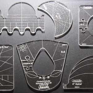 May include: A set of 10 clear plastic quilting templates for creating different shapes, including circles, spirals, and a teardrop shape. The templates are labeled with their size and purpose.