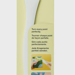 May include: White Clover Point 2 Point Turner tool on a green and yellow package. The package has text in multiple languages, including "Point 2 Point Turner". The tool is designed for turning points perfectly.