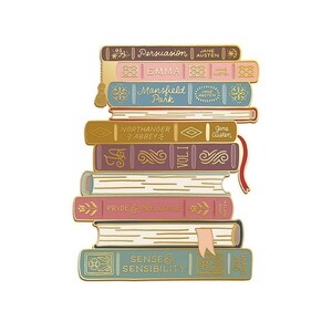 May include: A stack of colorful enamel pins shaped like classic books. Titles include "Persuasion," "Emma," "Mansfield Park," "Northanger Abbey," "Pride & Prejudice," and "Sense & Sensibility." Each pin features gold accents and the author's name, Jane Austen.