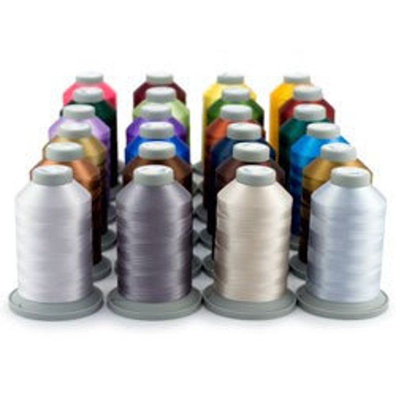 May include: A set of 24 spools of embroidery thread in various colors, including red, blue, green, yellow, purple, and brown. The spools are arranged in a grid pattern on a white background.
