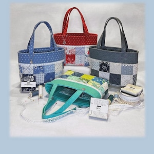 May include: Image of several mini tote bags in various colors and patterns, including blue, red, and gray. The bags are approximately 7 inches tall, 10 inches wide, and 3 inches deep. The text "Mini-Charming Tote Bag" is displayed at the top.