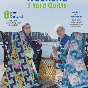 May include: A quilt pattern book titled Weekend 3-Yard Quilts by Donna Robertson and Fran Morgan. The cover features two people sitting outdoors with two finished quilts, one with a floral pattern and one with a blue geometric design.