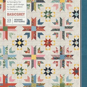 May include: A quilt pattern featuring a repeating star design in various colors including red, pink, blue, and yellow. The quilt is made with floral and geometric patterned fabrics. The text "OUT WEST PAT041" and "BASICGREY SEWING PATTERNS" are visible.