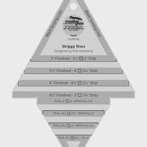 May include: A gray and white Creative Grids Strippy Stars quilting template. The template includes measurements for various strip sizes, ranging from 1 inch to 5 inches. Text on the template includes the designer's name and the product name.