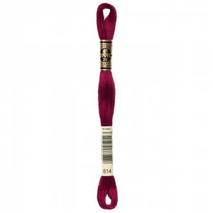 May include: DMC embroidery floss in color 814, a deep burgundy red. The floss is wound on a card with the DMC logo and the color number.