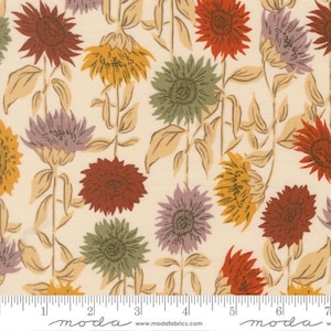 May include: Floral fabric with a repeating pattern of sunflowers in red, yellow, green, and purple. The flowers are set against a cream background with tan stems and leaves. A ruler is along the bottom of the fabric.