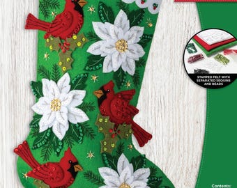 May include: Green felt Christmas stocking with red cardinals, white poinsettias, and holly accents. The stocking is 18 inches (45.72 cm) long and features the name "Leah" in red script. Includes stamped felt, sequins, beads, cotton floss, and needles.
