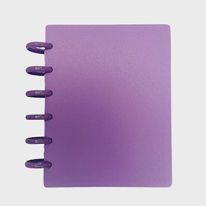 May include: A rectangular notebook with a solid light purple cover and a matching purple disc-bound spine system. The notebook features six circular discs along the left edge that hold the cover in place, providing a clean and simple appearance.