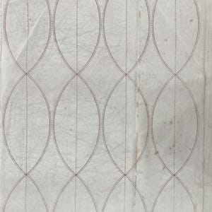May include: A quilting pattern template with the title "Rob Pete" and instructions for making a quilt. The template includes a grid of 12 oval shapes with dashed lines for cutting and solid lines for stitching.