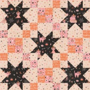 May include: A quilt featuring a repeating star pattern with alternating black and light peach fabric blocks. The black blocks display illustrations of cats, pumpkins, and spiderwebs, while the peach blocks feature small stars and text.